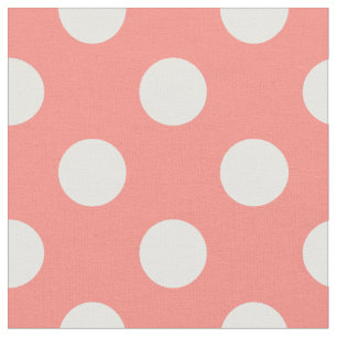 White polka dots on peach fabric