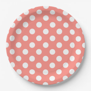 White polka dots on peach paper plate