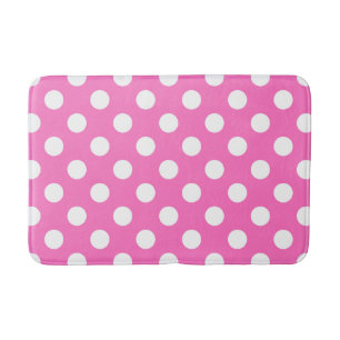 White polka dots on pink bath mat