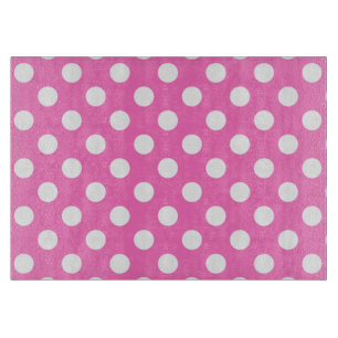 White polka dots on pink cutting board