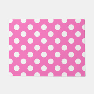 White polka dots on pink doormat