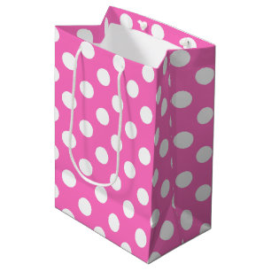 White polka dots on pink medium gift bag