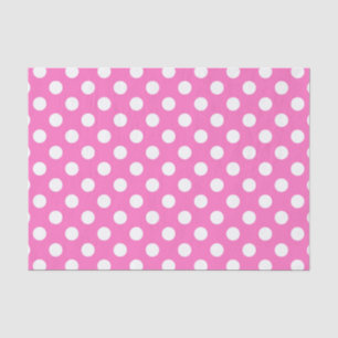 White polka dots on pink tissue paper