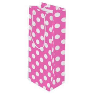 White polka dots on pink wine gift bag