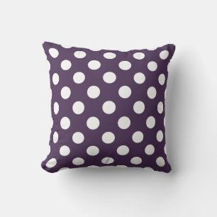 White polka dots on plum purple cushion