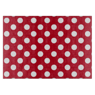 White polka dots on red cutting board