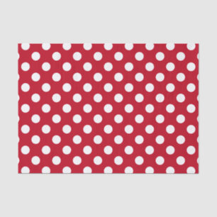 White polka dots on red tissue paper