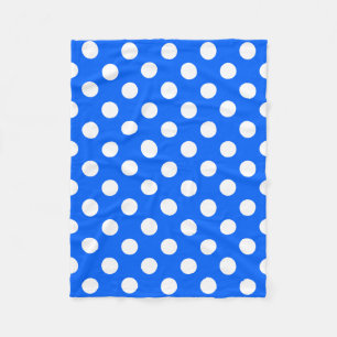 White polka dots on royal blue fleece blanket