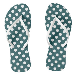 White polka dots on teal flip flops