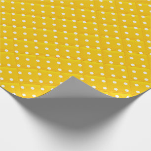 white polka dots on yellow wrapping paper