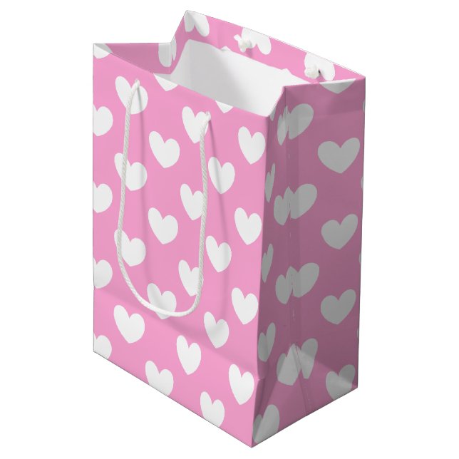 White polka hearts on Cotton Candy Pink Medium Gift Bag (Front Angled)