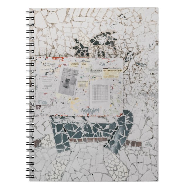 White printer paper on white and gray concrete wal notebook (Front)