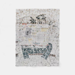 White printer paper on white and grey concrete wal fleece blanket