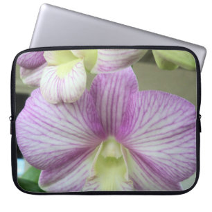 White & purple Orchids on a laptop sleeve