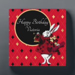 White Rabbit in Red Birthday Plaque<br><div class="desc">Festive birthday greeting features vintage illustration of the White Rabbit in red tinted Queen of Hearts garb with black and gold customizable text circle and red / gold / black diamond background</div>
