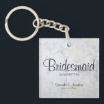 White Reflections Bridesmaid Wedding Favour Key Ring<br><div class="desc">This beautiful keychain is perfect for thanking your bridesmaids. Designed as a part of our White Reflections Wedding Suite, it features black text over a background of reflecting white flowers and hearts. The text is fully customisable and reads: Bridesmaid, with a place for her name, the couple's names and wedding...</div>