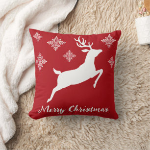 White Reindeer Silhouette On Red With Snowflakes Cushion