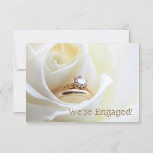 white rose and rings engagement announcement