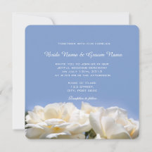 white rose flowers in blue wedding invitation