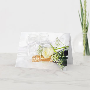 white rose on champagne bottle with pearls card