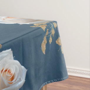 White roses and gold leaves on a blue background tablecloth