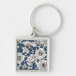 White roses with blue leaves on white key ring