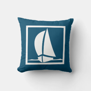 white sailboat on navy blue pillow