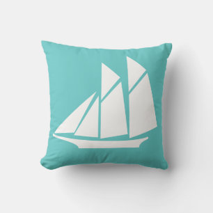 white sailboat on teal blue pillow
