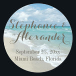 White Sandy Beach Waves Personalised Wedding Favou Classic Round Sticker<br><div class="desc">Perfect favour sticker for your beach island tropical wedding theme. Enjoy a private getaway on an island with white sand beaches, clear water and a blue sky with puffy white clouds. This lovely scenic vacation image provides just the mental getaway to stimulate the senses and calm the mind. Perfect for...</div>