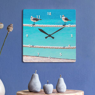 White seagull birds on rope with blue ocean photo square wall clock