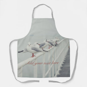 White seagull on a winter day apron