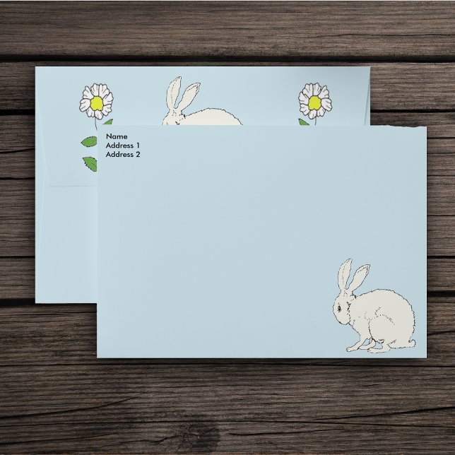 White Sitting Rabbit Daisy Flowers on Stems blue Envelope (Pretty sitting white bunny with white daisy flowers on stems on light blue mailing envelopes.)