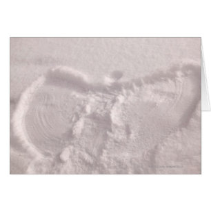 White snow imprinted with a snow angel