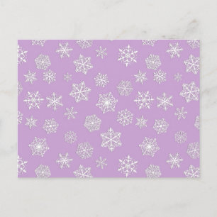 White snowflakes against soft lavender postcard
