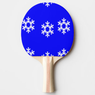 White snowflakes on blue ping pong paddle