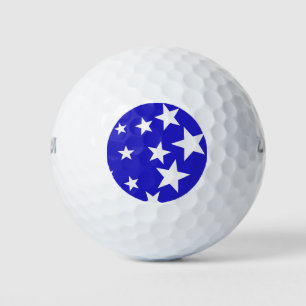 White star pattern on blue background golf balls