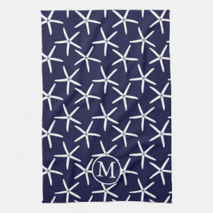 White starfish on a navy blue background tea towel