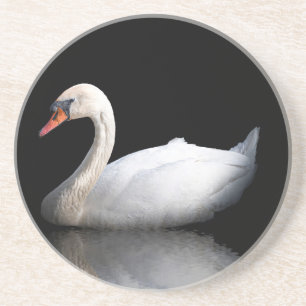 White swan on black coaster