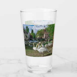 White swans in Bruges downtown Glass
