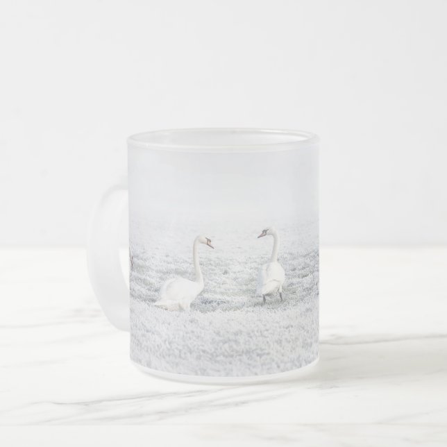 White swans in winter snow frosted glass coffee mug (Front Left)