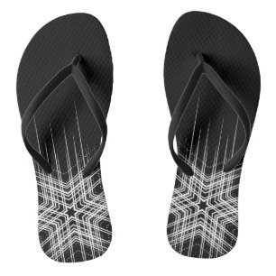 White tattoo design in dark flip flops