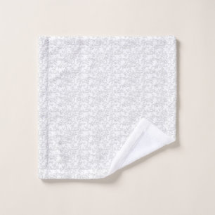 White textured background with subtle, interwoven, bath towel set