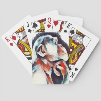 White thinker monkey playing cards