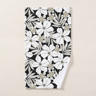 White tropical flowers on black hand towel