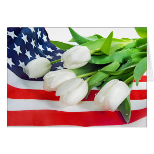 white tulips on American flag