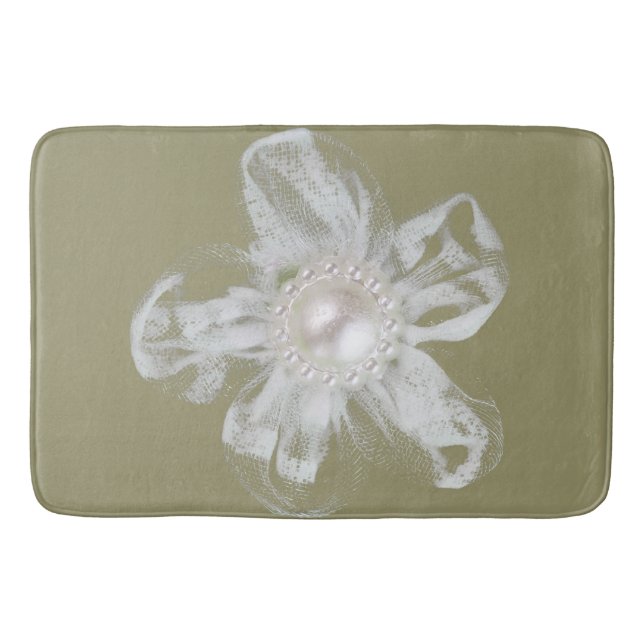 White tulle flower on light taupe bath mat (Front)