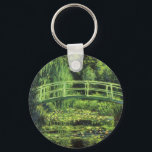 White Waterlilies by Claude Monet, Vintage Art Key Ring<br><div class="desc">White Waterlilies (1899) by Claude Monet is a vintage impressionist fine art floral nature painting. It is one of many variations of the water lilies and Japanese footbridge paintings that Monet painted in his spring season flower garden in Giverny, France. A pedestrian bridge over a pond in green tones. About...</div>