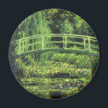 White Waterlilies by Claude Monet, Vintage Art Magnet<br><div class="desc">White Waterlilies (1899) by Claude Monet is a vintage impressionist fine art floral nature painting. It is one of many variations of the water lilies and Japanese footbridge paintings that Monet painted in his spring season flower garden in Giverny, France. A pedestrian bridge over a pond in green tones. About...</div>