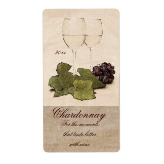 white wine glasses with grapes wine label
