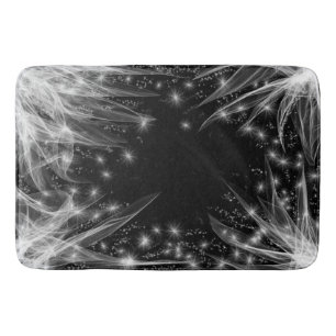 White wispy tendrils & stars on a black background bath mat